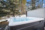 Soak in your private hot tub, located behind the home. 